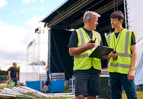 events management staff discussing equipment hire for events in Australia