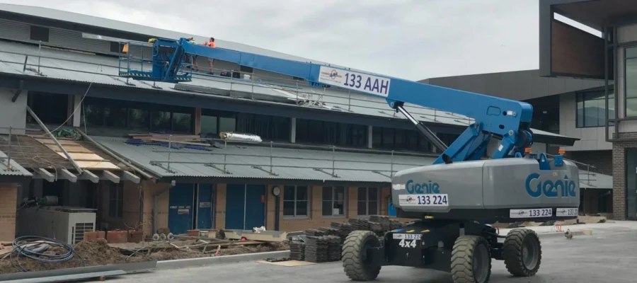 A genie straight boom lift working on an Australian construction site